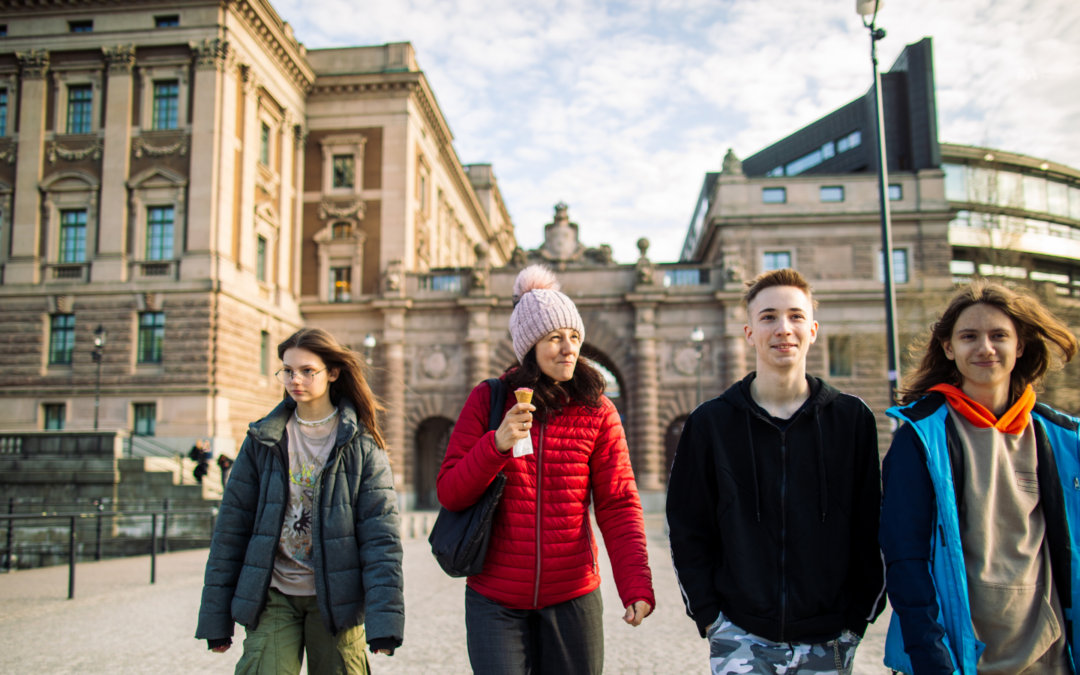 4 youths walk around in Stockholm